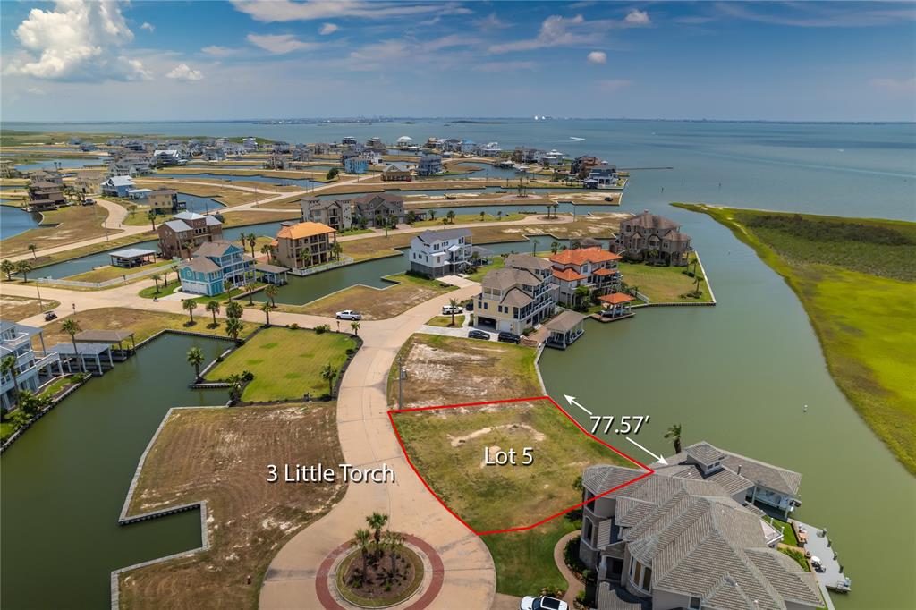 an aerial view of a house with a ocean view