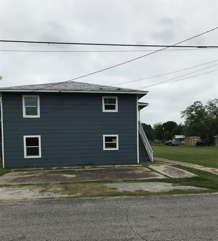 a view of a house with a street