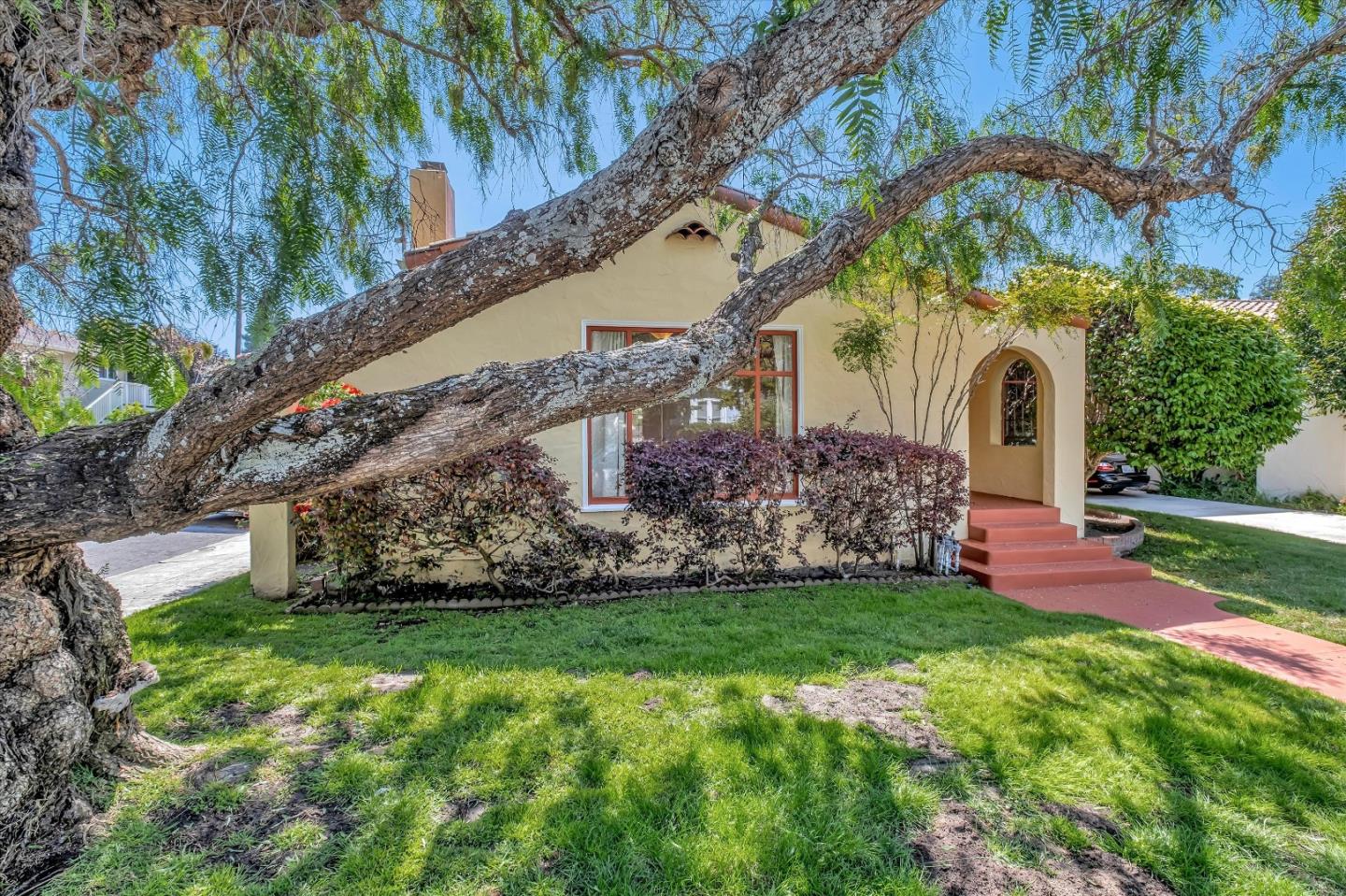 a front view of a house with a yard