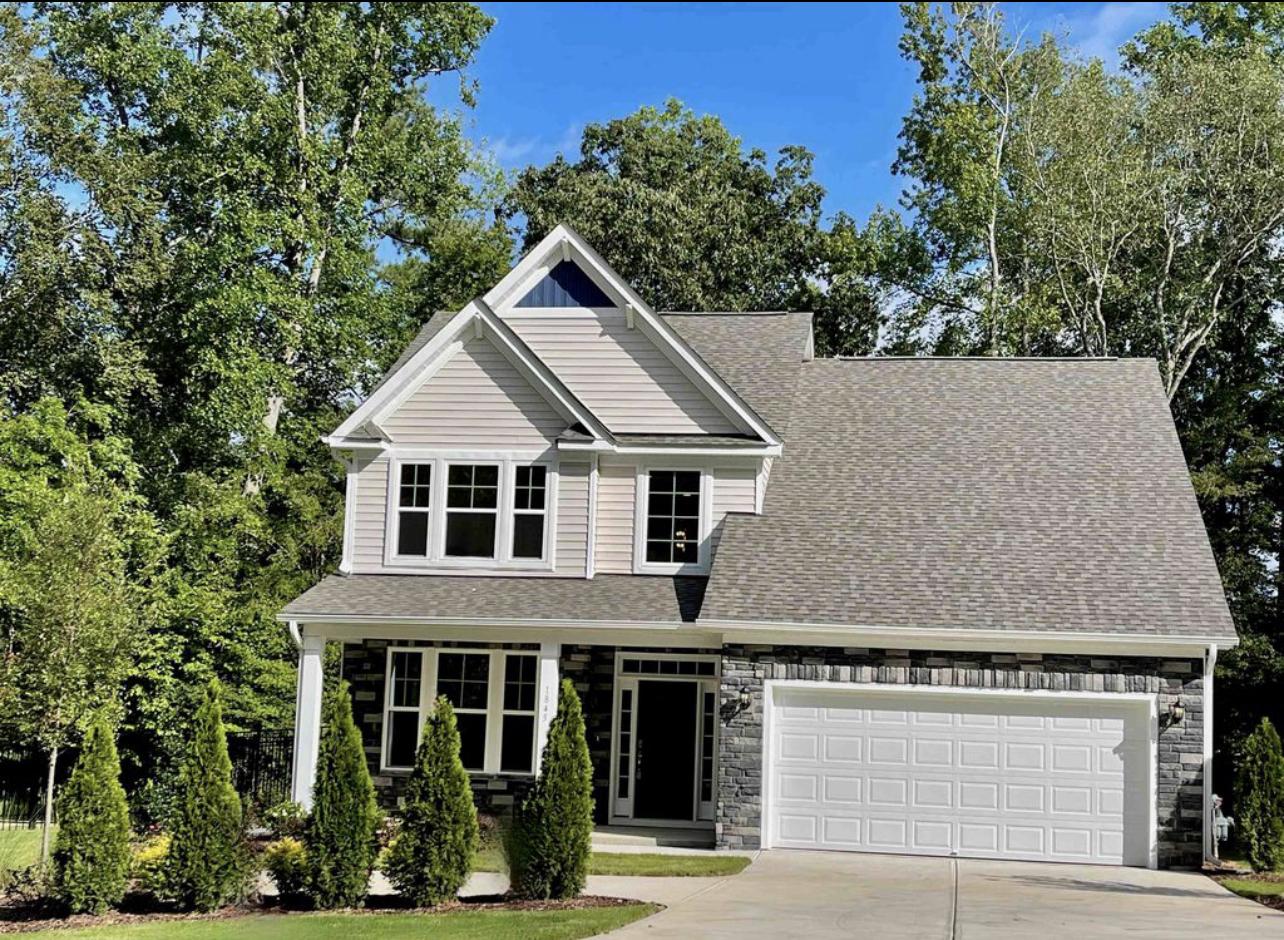 front view of a house with a yard