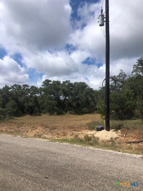 a view of a road with a yard