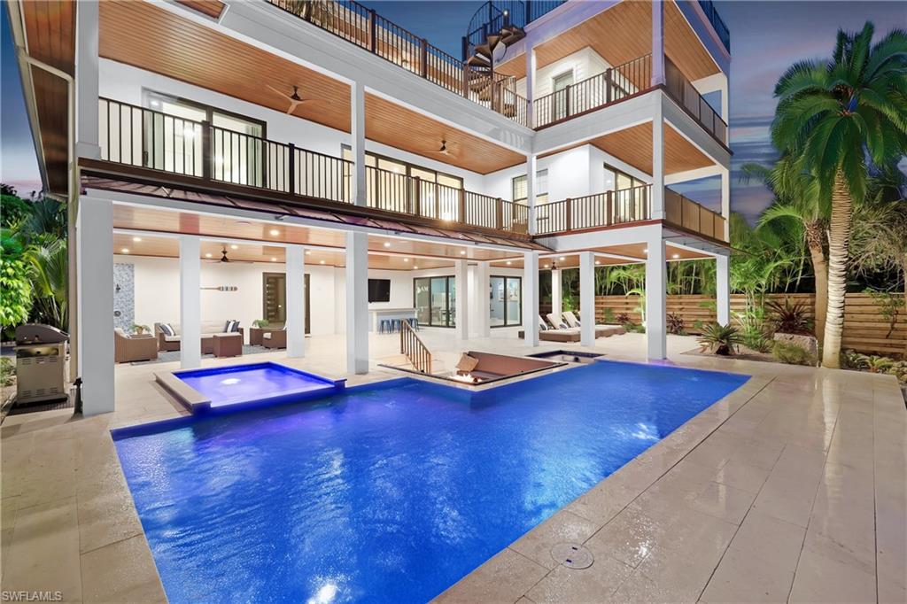 a view of a house with pool table and chairs