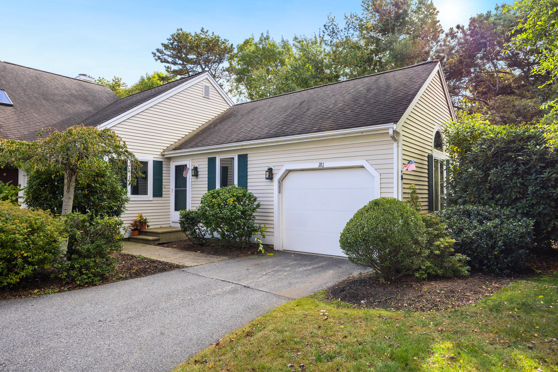 a front view of a house with garden