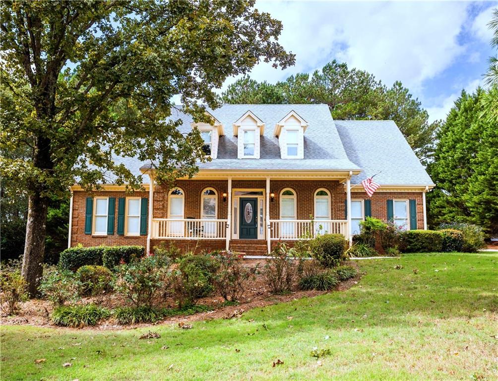 front view of a house with a yard