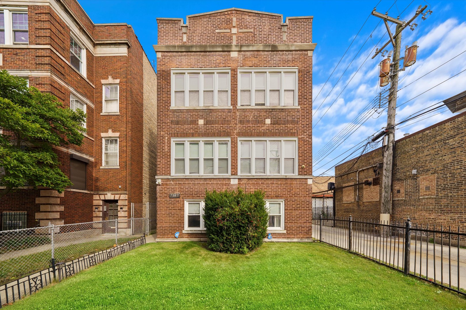 a view of a front of a brick building