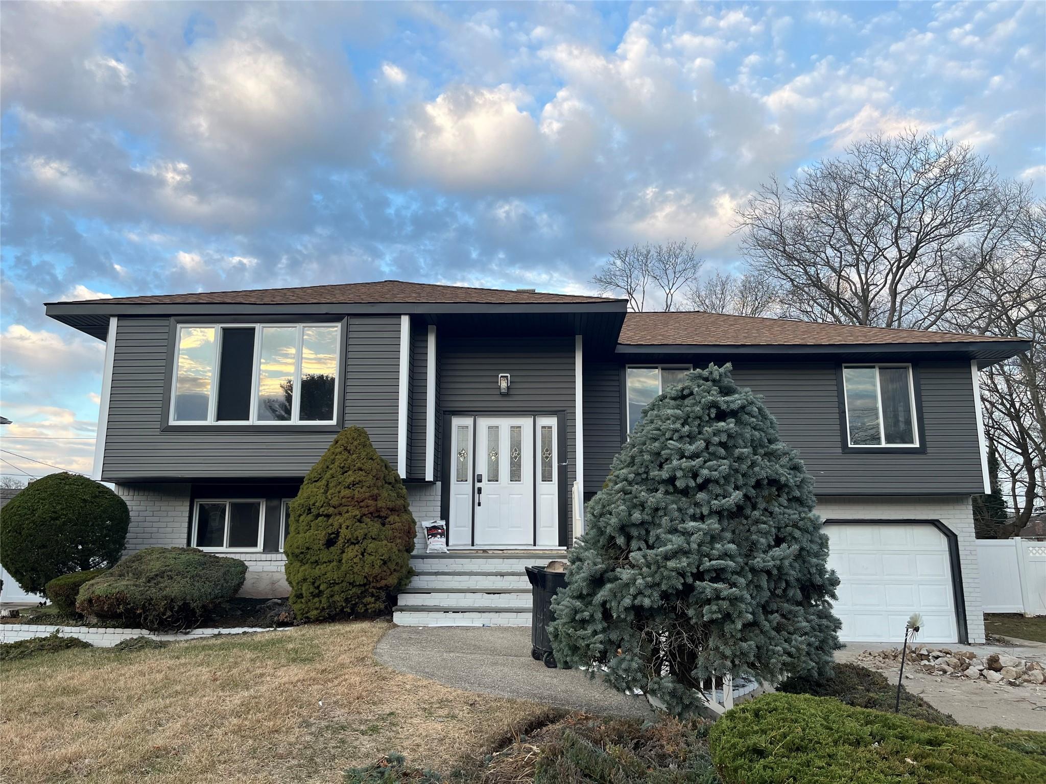 View of front of property featuring a garage