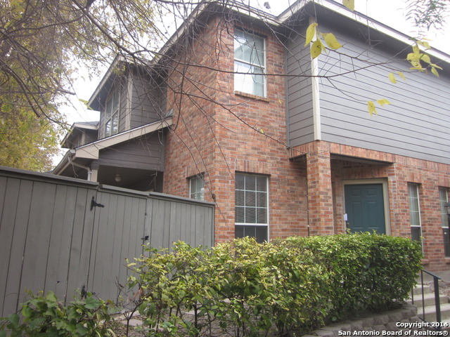 a view of a house with a yard and plants