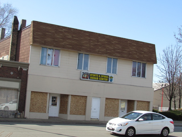 a front view of a house with parking