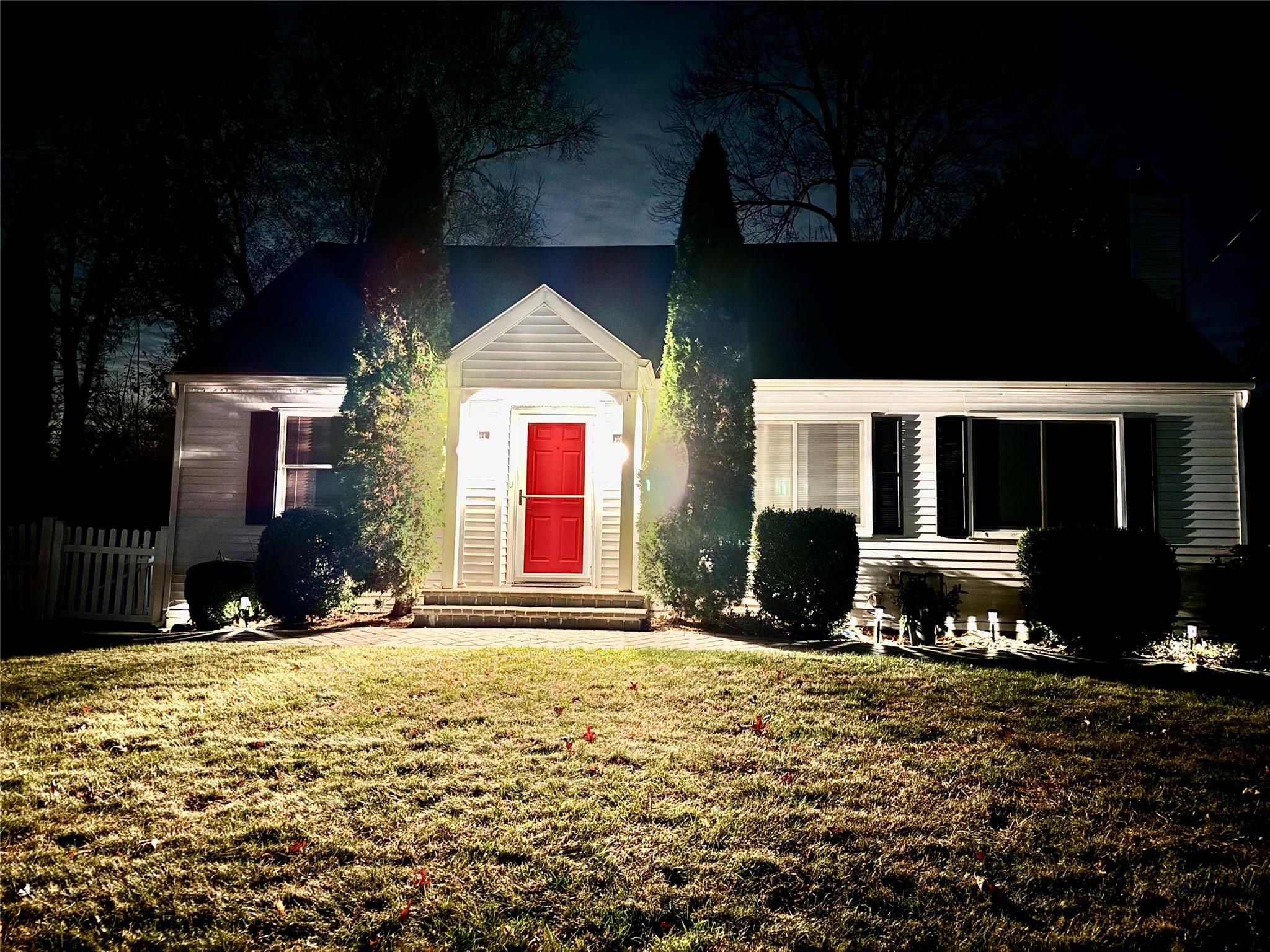 a view of a house with backyard porch and garden