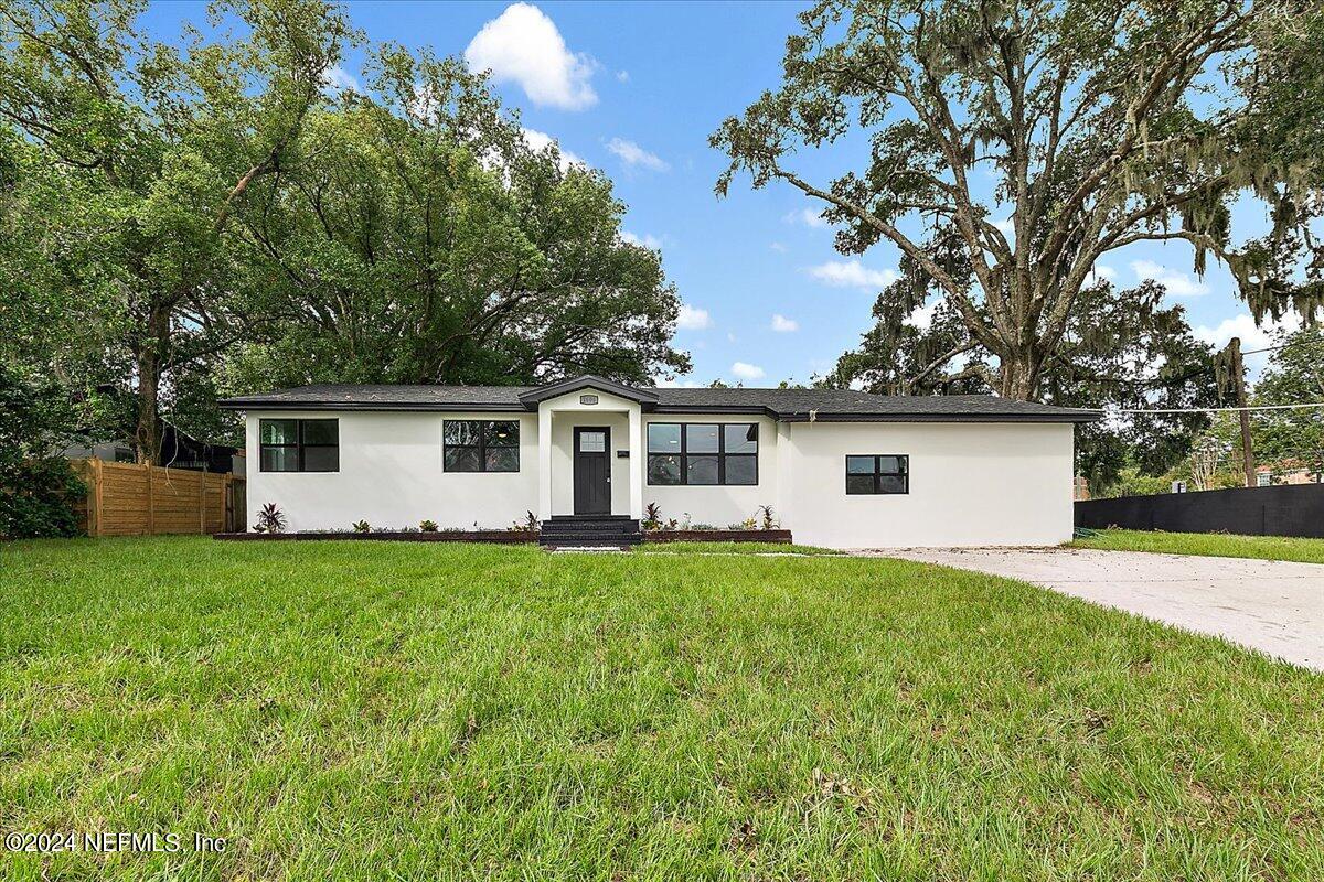 front view of a house with a yard