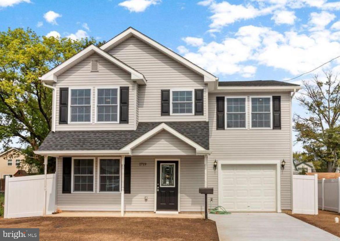 a front view of a house with garage