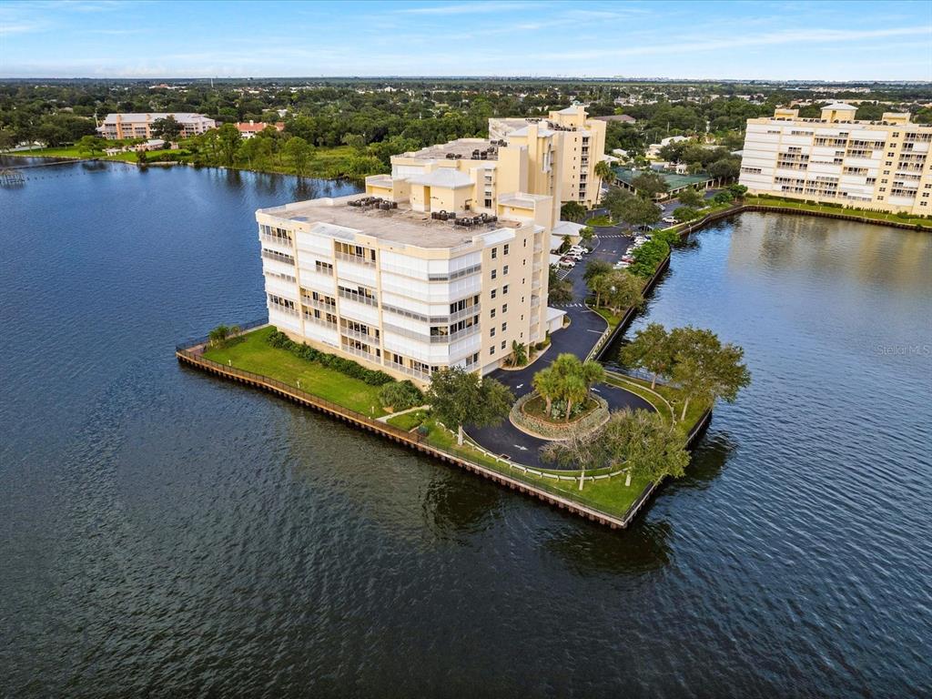 an aerial view of a house with a ocean view