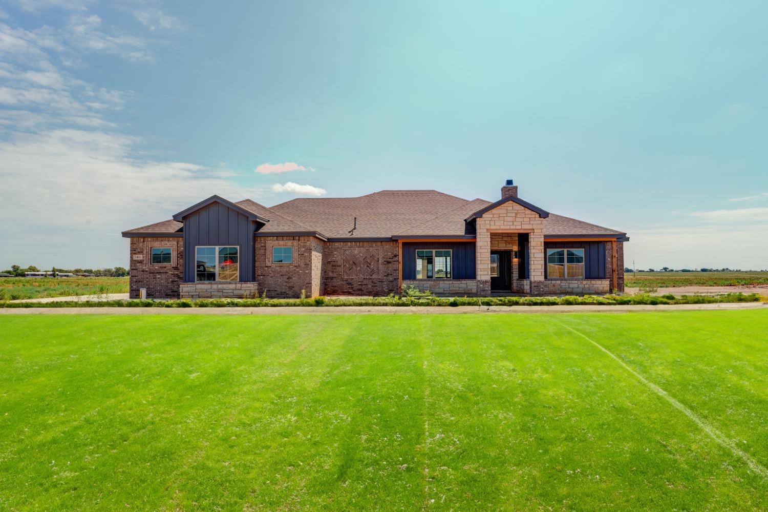 a front view of house with yard and seating area