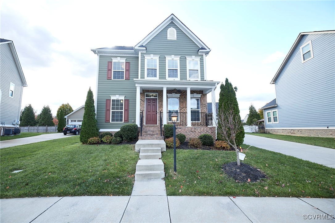 View of front of house featuring covered porch and