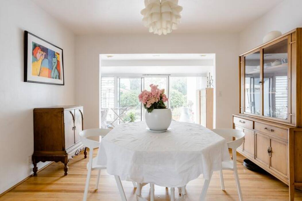 a dining room with furniture and window