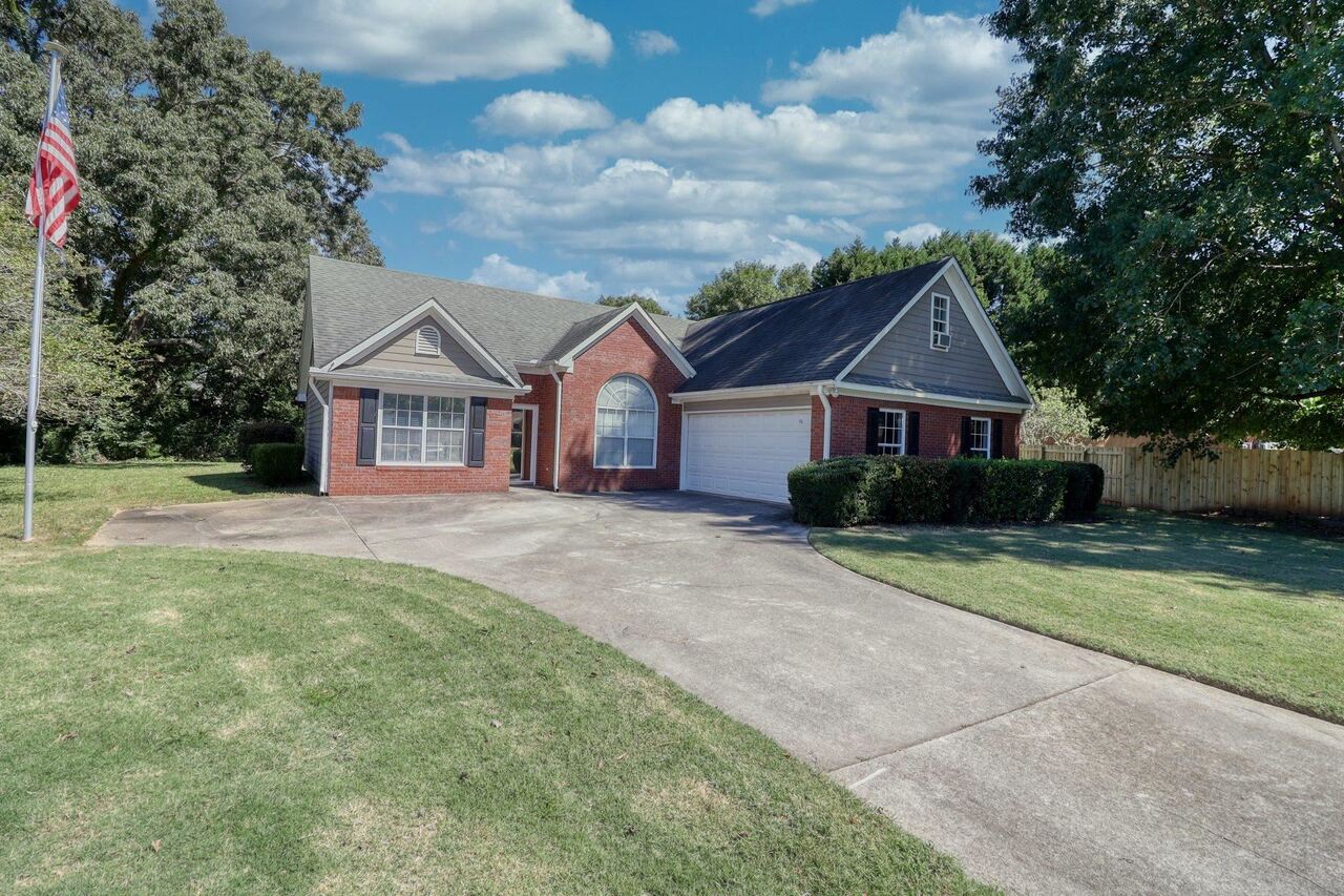 a front view of a house with yard