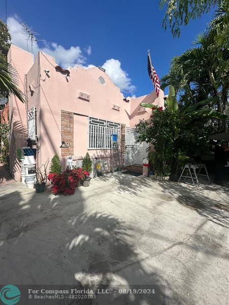 a view of a street with a building in the background