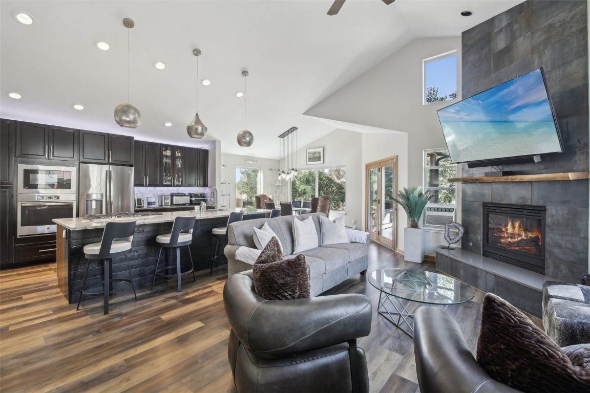 a living room with lots of furniture and a fireplace