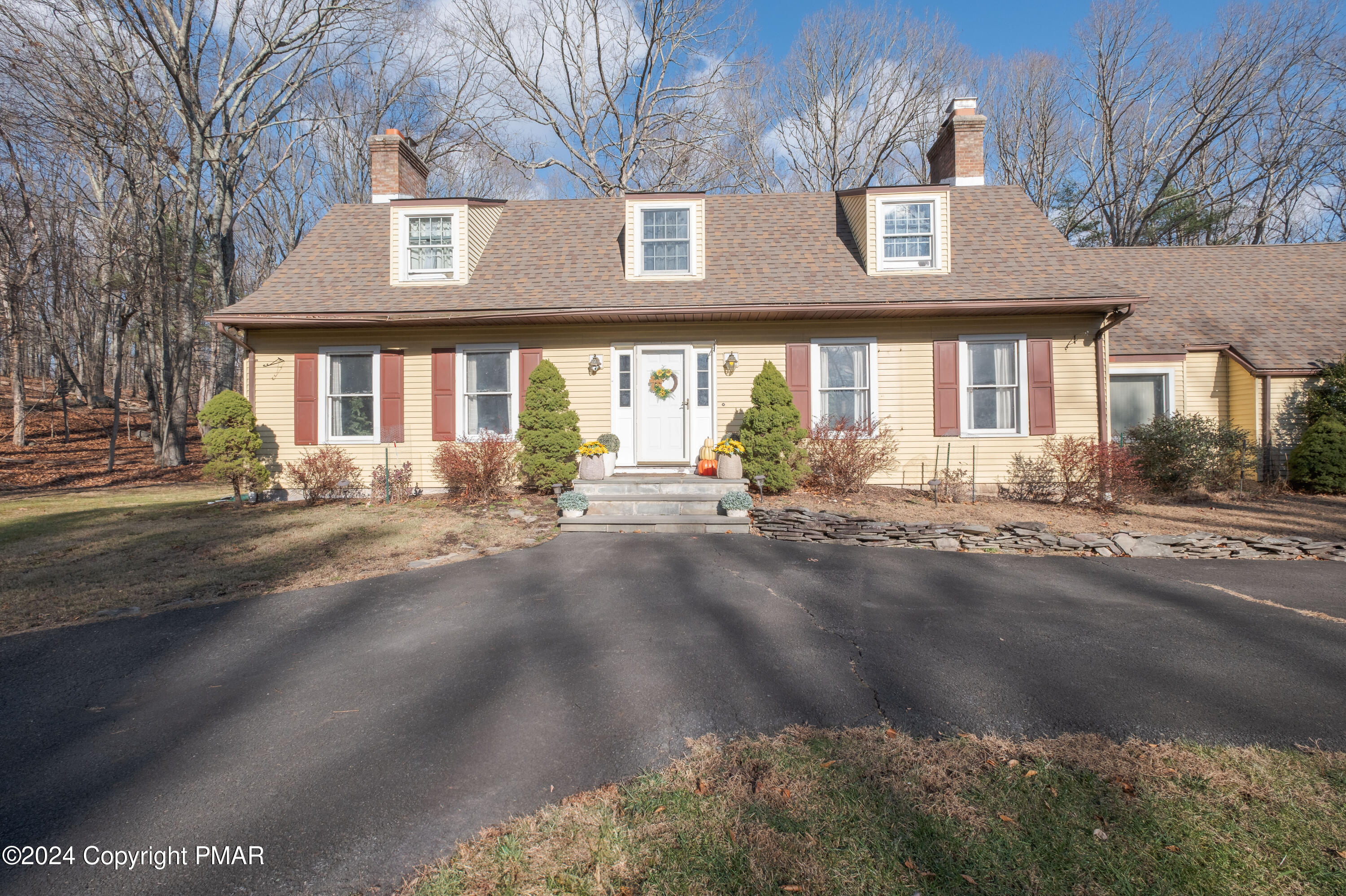 a front view of a house with a yard