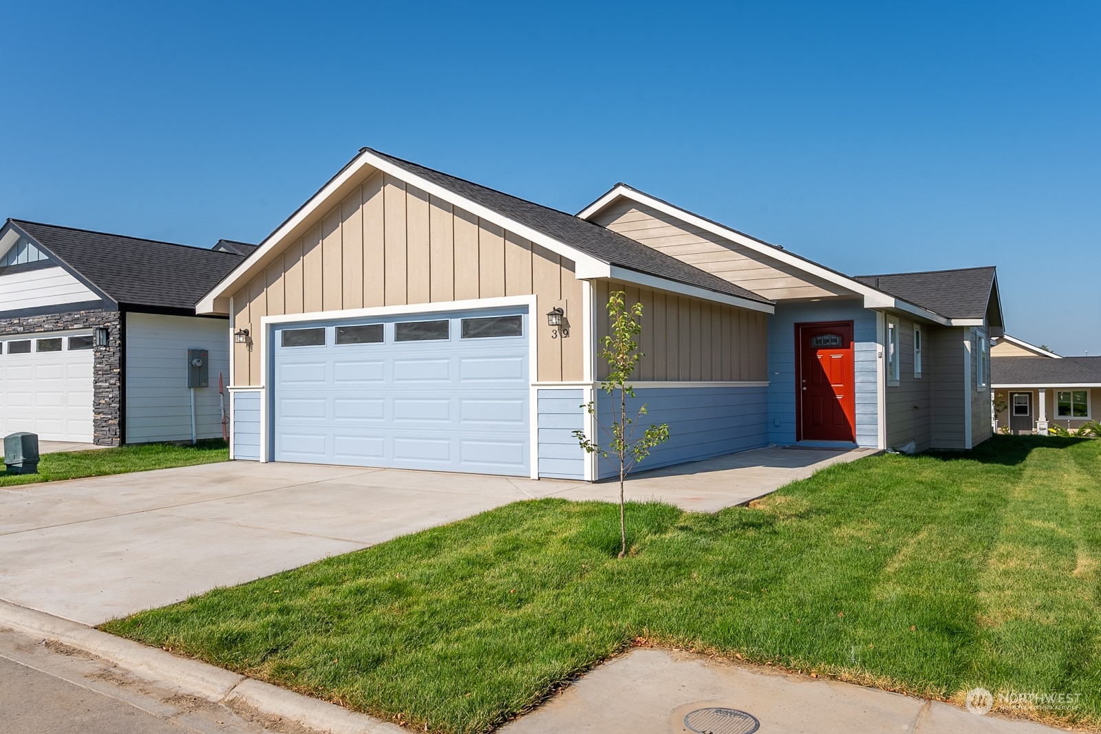 a front view of house with yard and green space