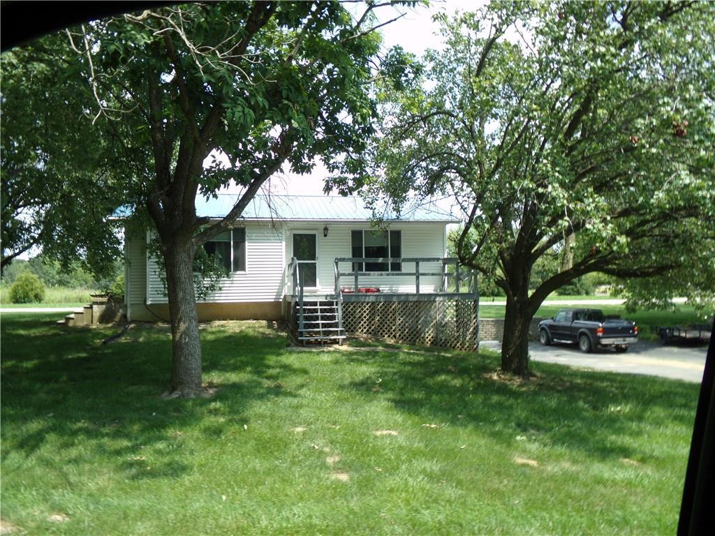 a view of a house with a yard porch and sitting area