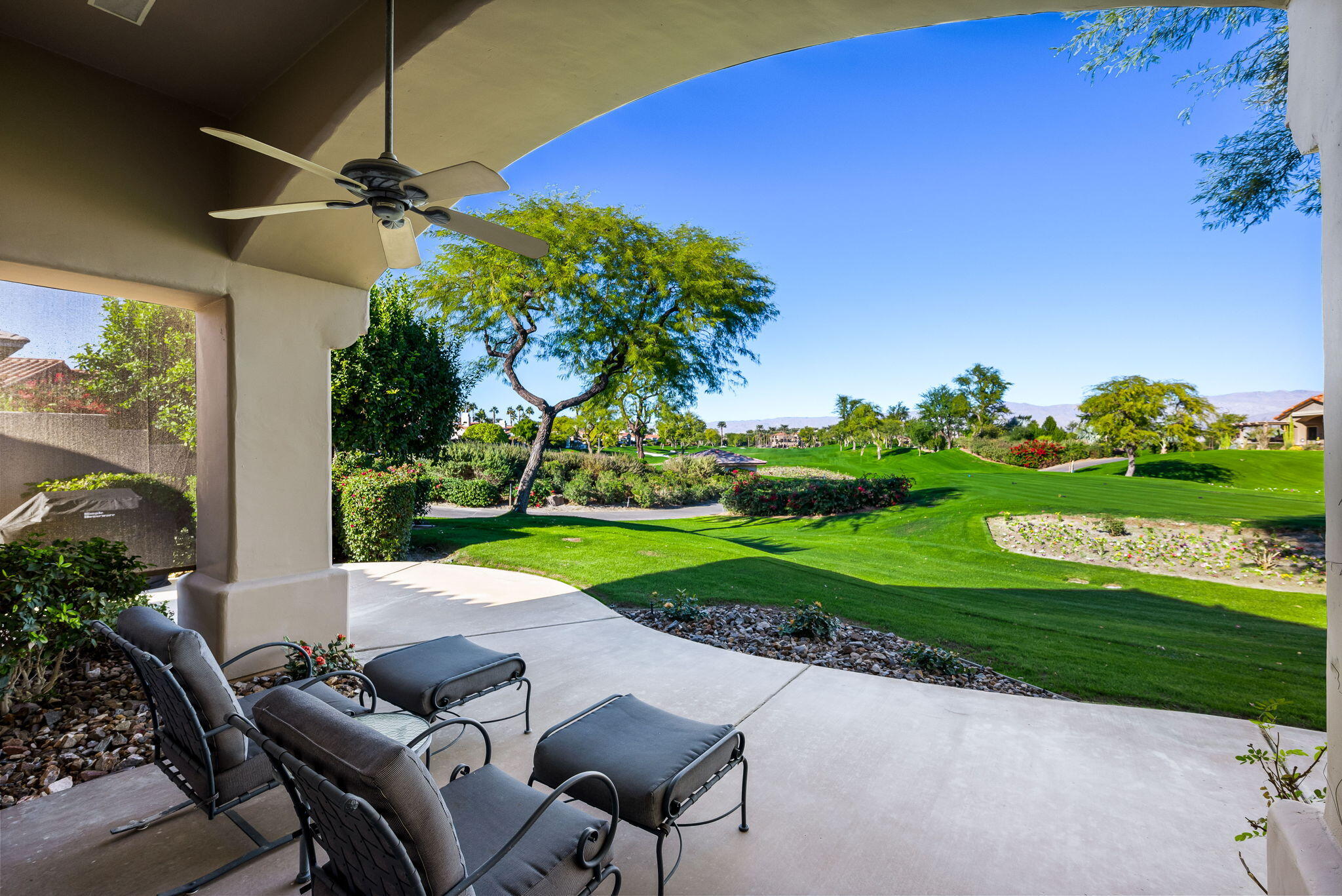 a view of yard with swimming pool and green space