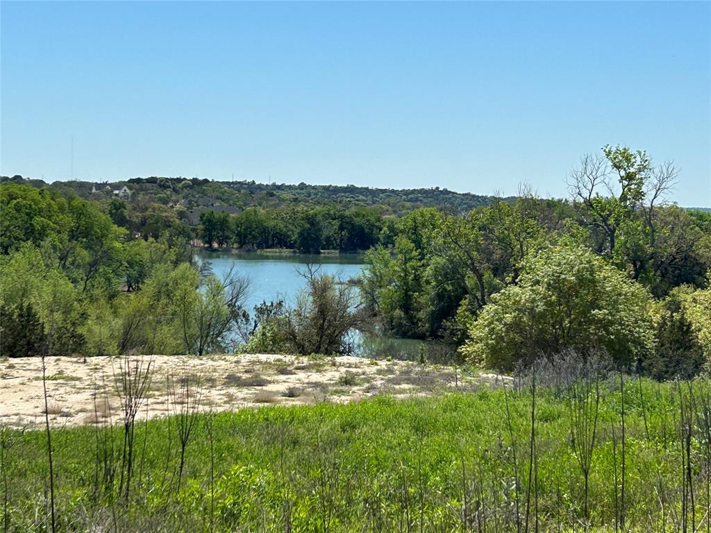 a view of a lake with a yard