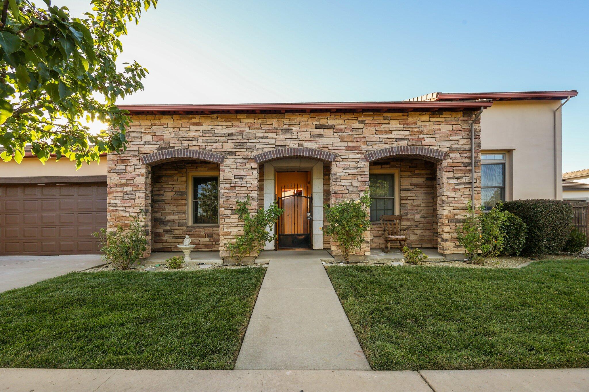 front view of a house with a yard