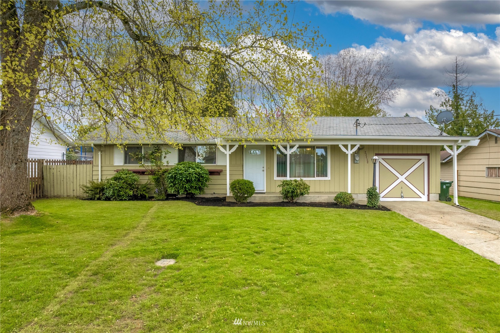 front view of a house with a big yard