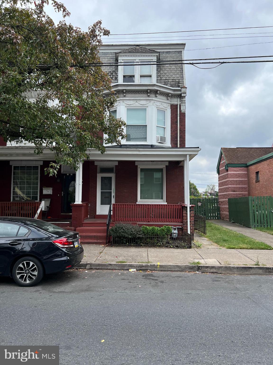 a car parked in front of a house