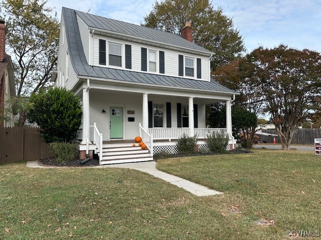 View of front facade featuring covered porch and a