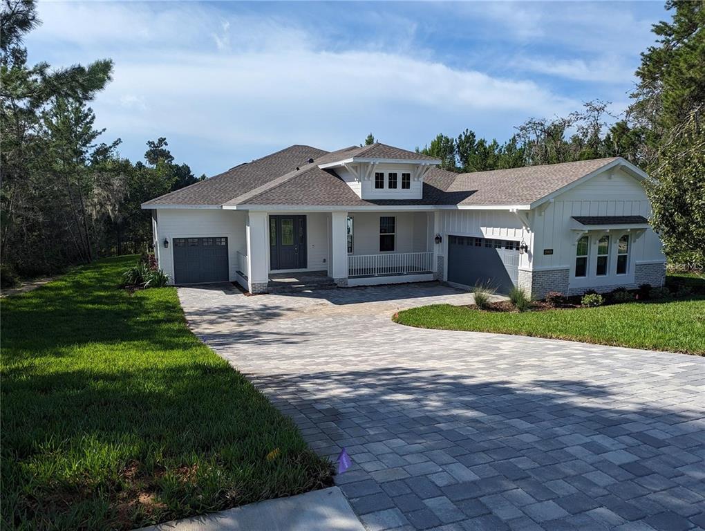 a view of house with yard and entertaining space