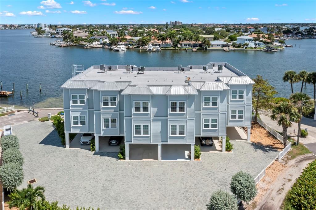 an aerial view of a house with a lake view