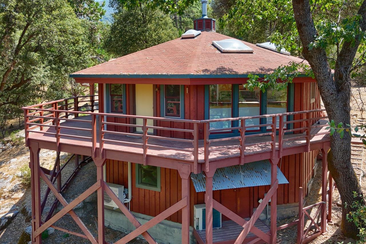 a front view of a house with table and chairs