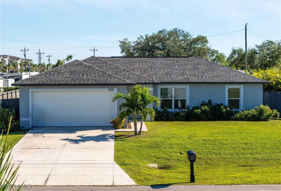 a view of a house with swimming pool and a yard