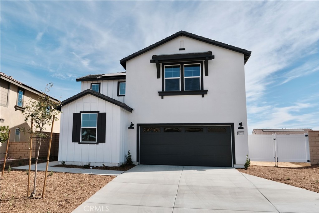 a front view of a house with garage