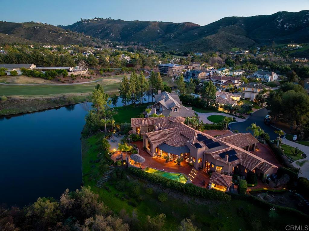 an aerial view of residential house and outdoor space