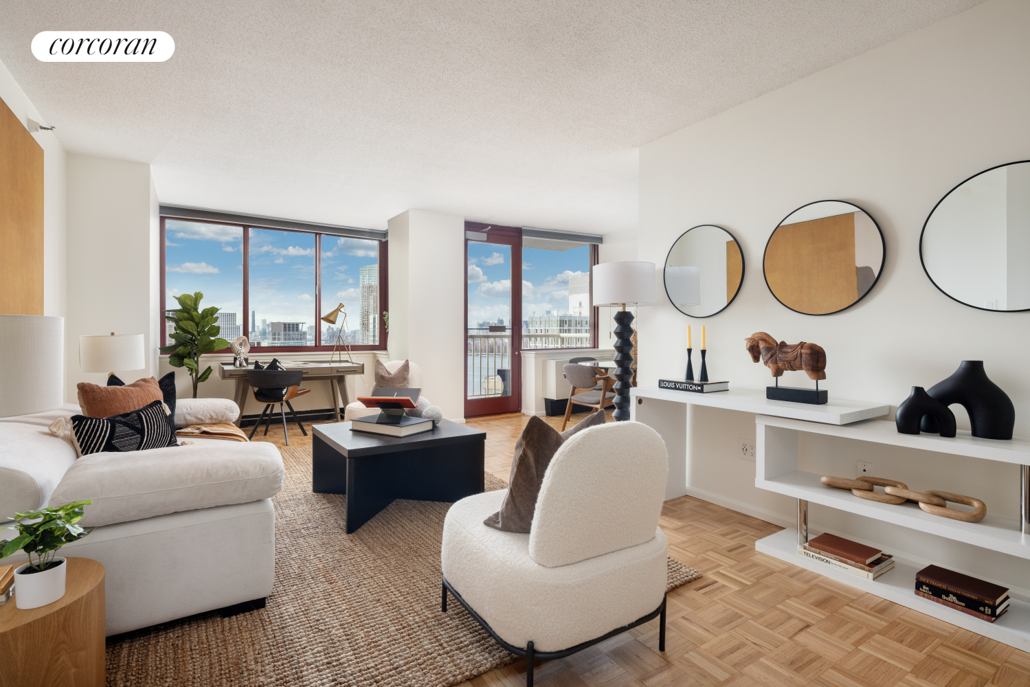 a living room with furniture a rug and white walls