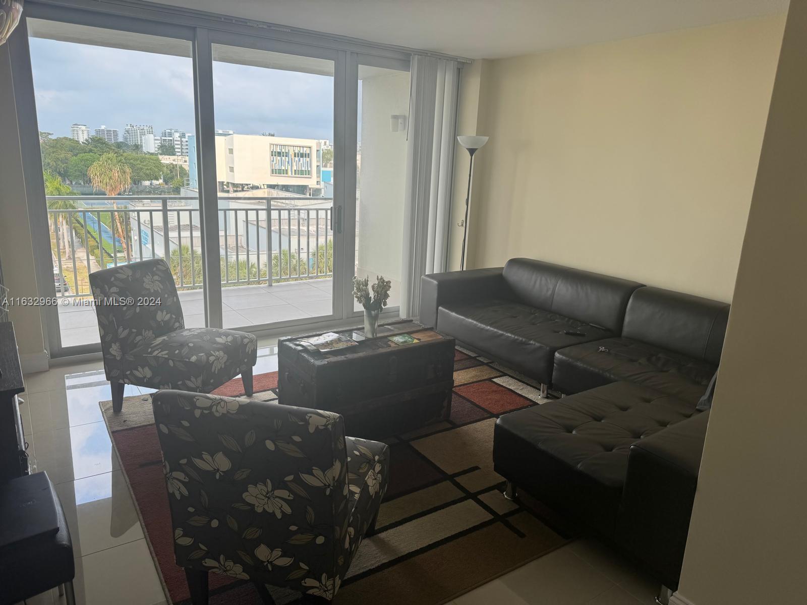 a living room with furniture and a window