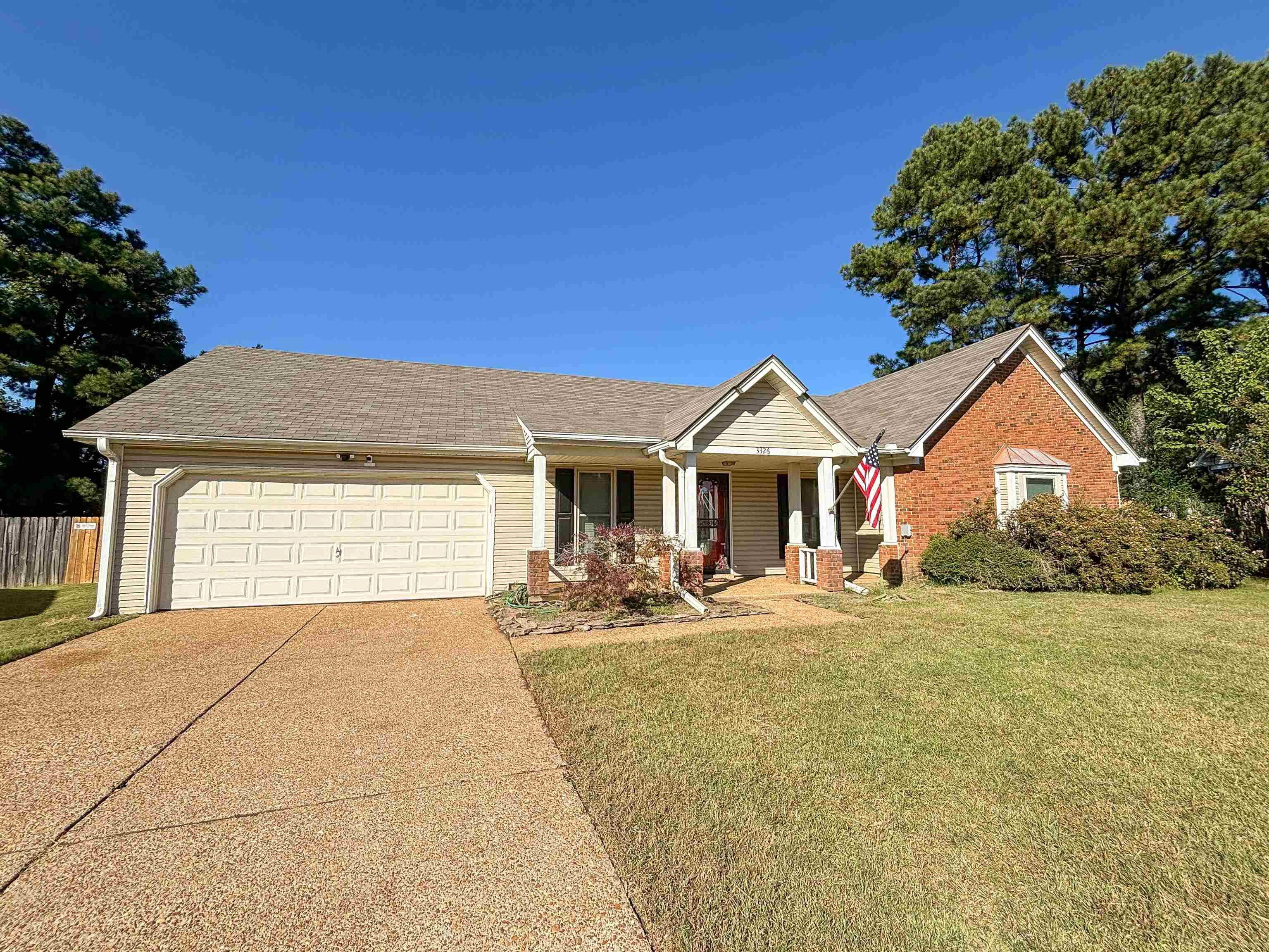 a front view of a house with yard