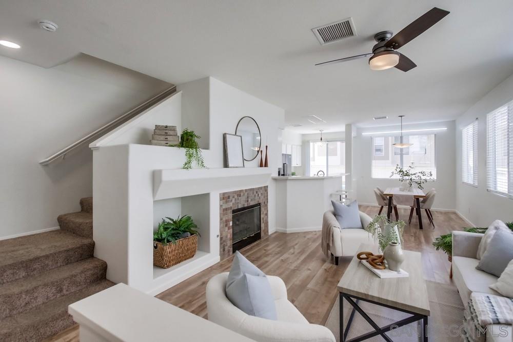 a living room with furniture and a fireplace