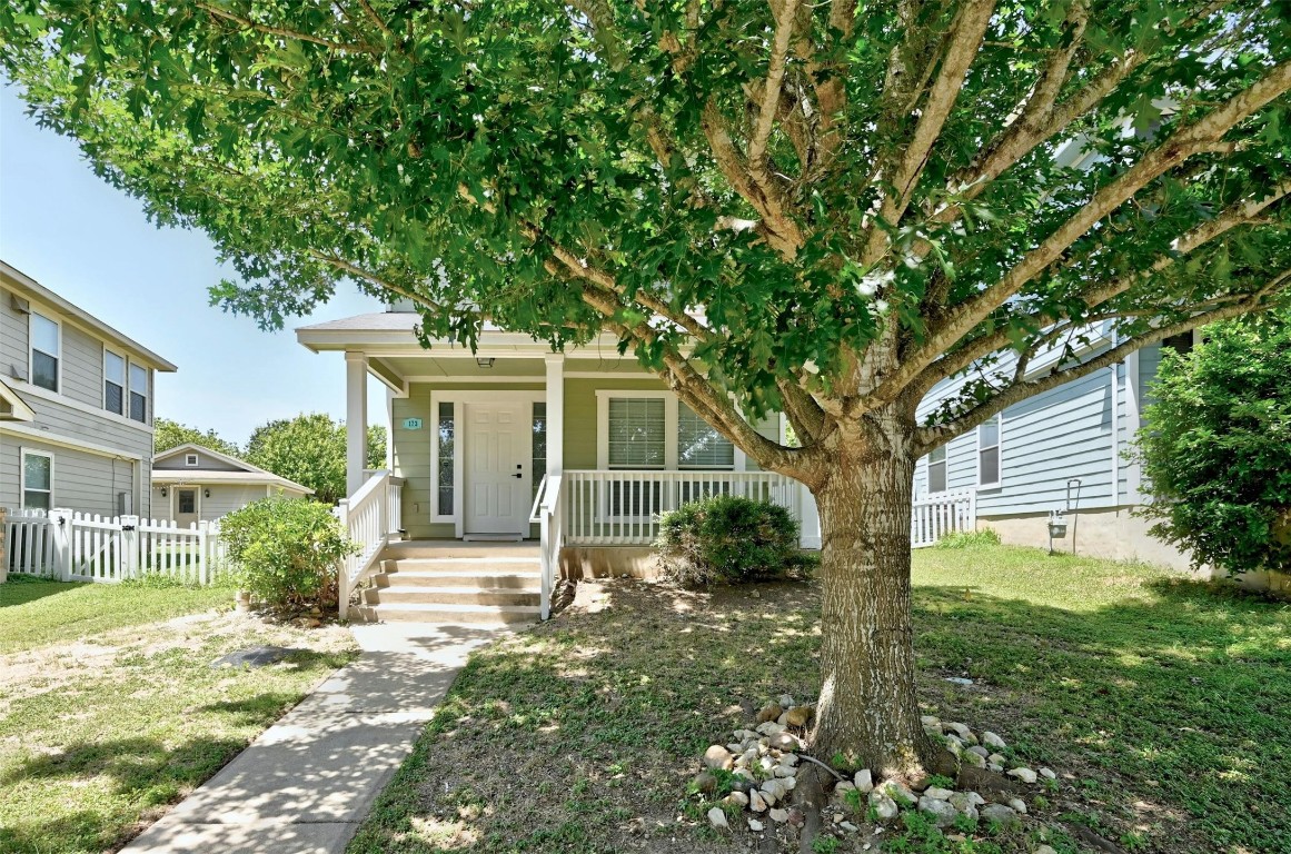 a front view of a house with garden