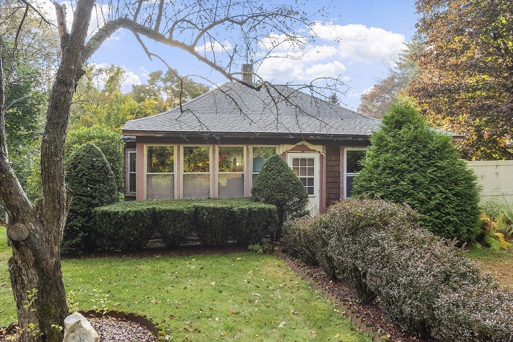 a front view of a house with garden