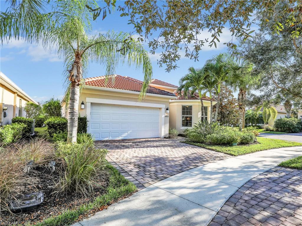 Mediterranean / spanish house featuring a garage