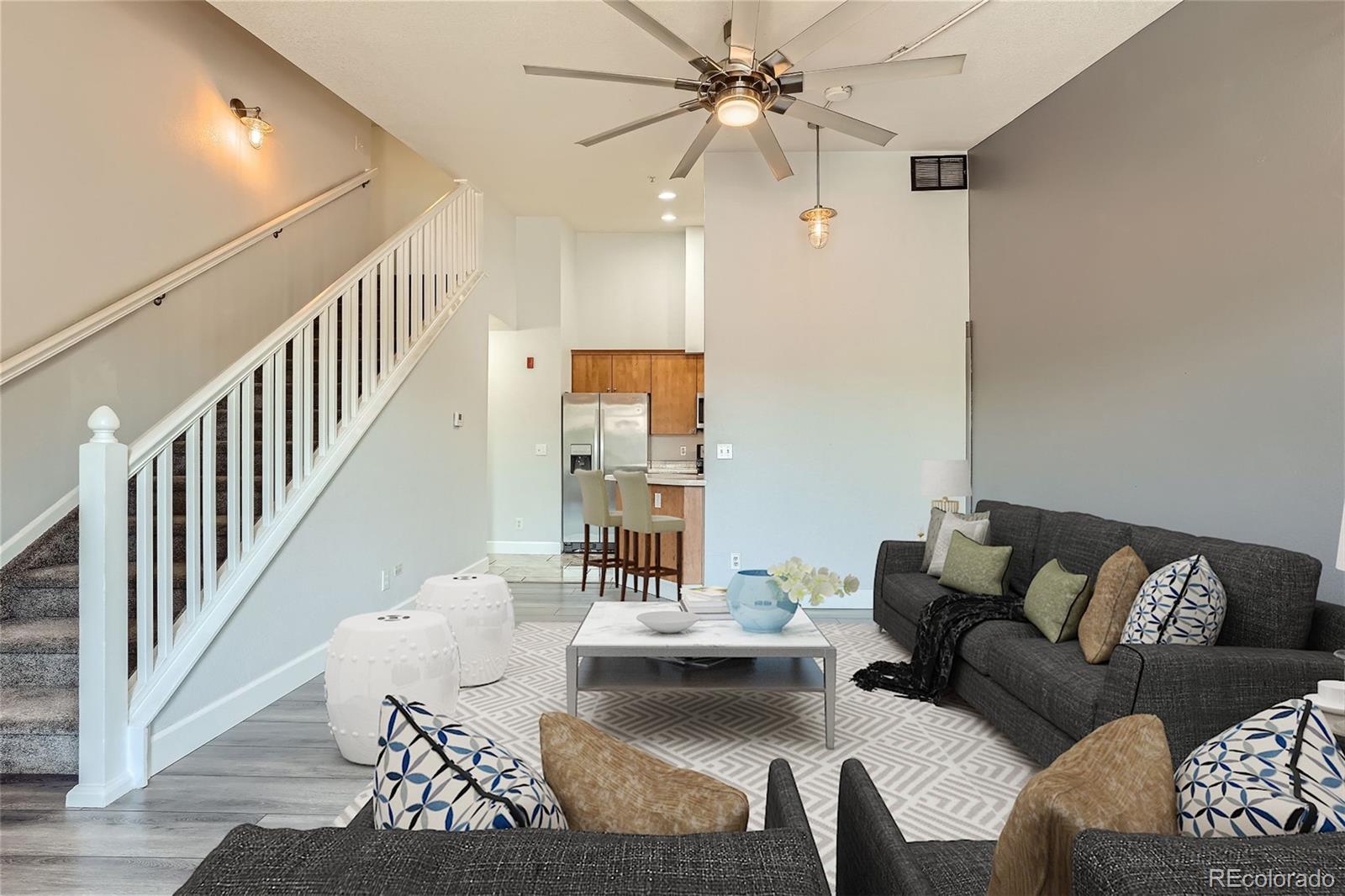 a living room with furniture and a chandelier