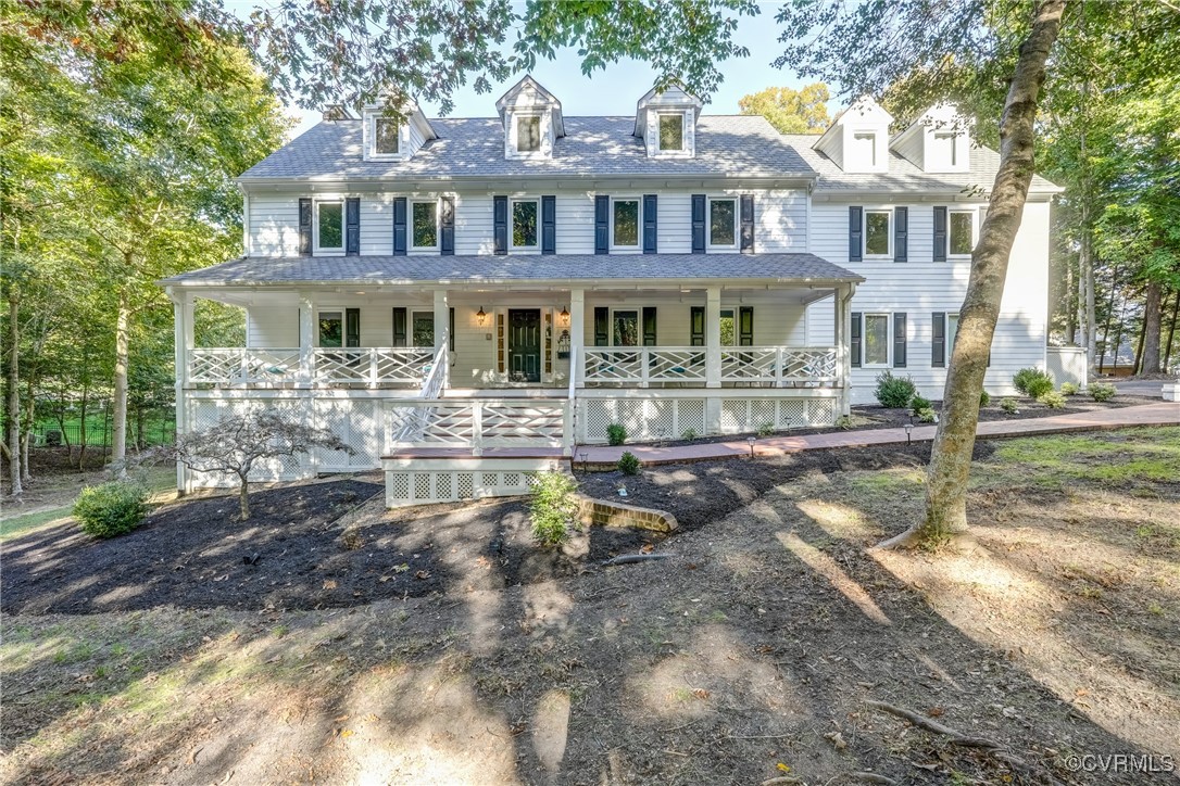 a front view of a house with yard and sitting area