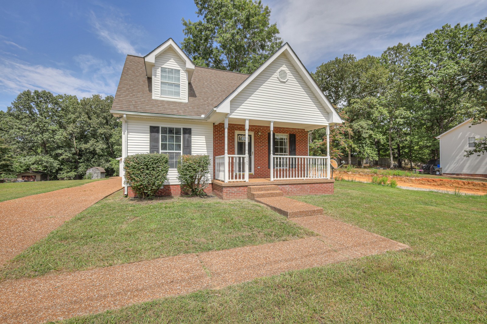 front view of a house and a yard