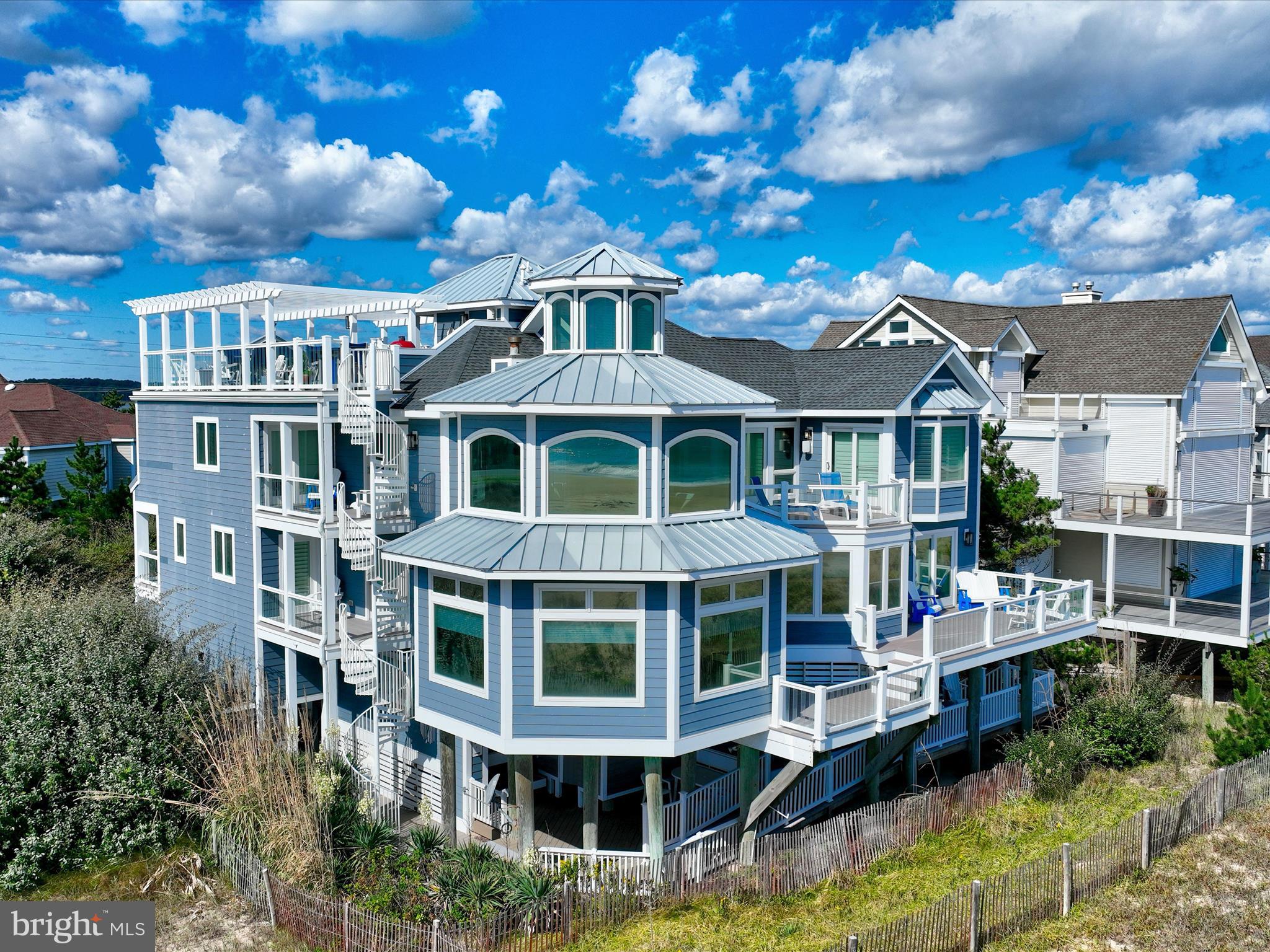 a front view of a residential apartment building with a yard