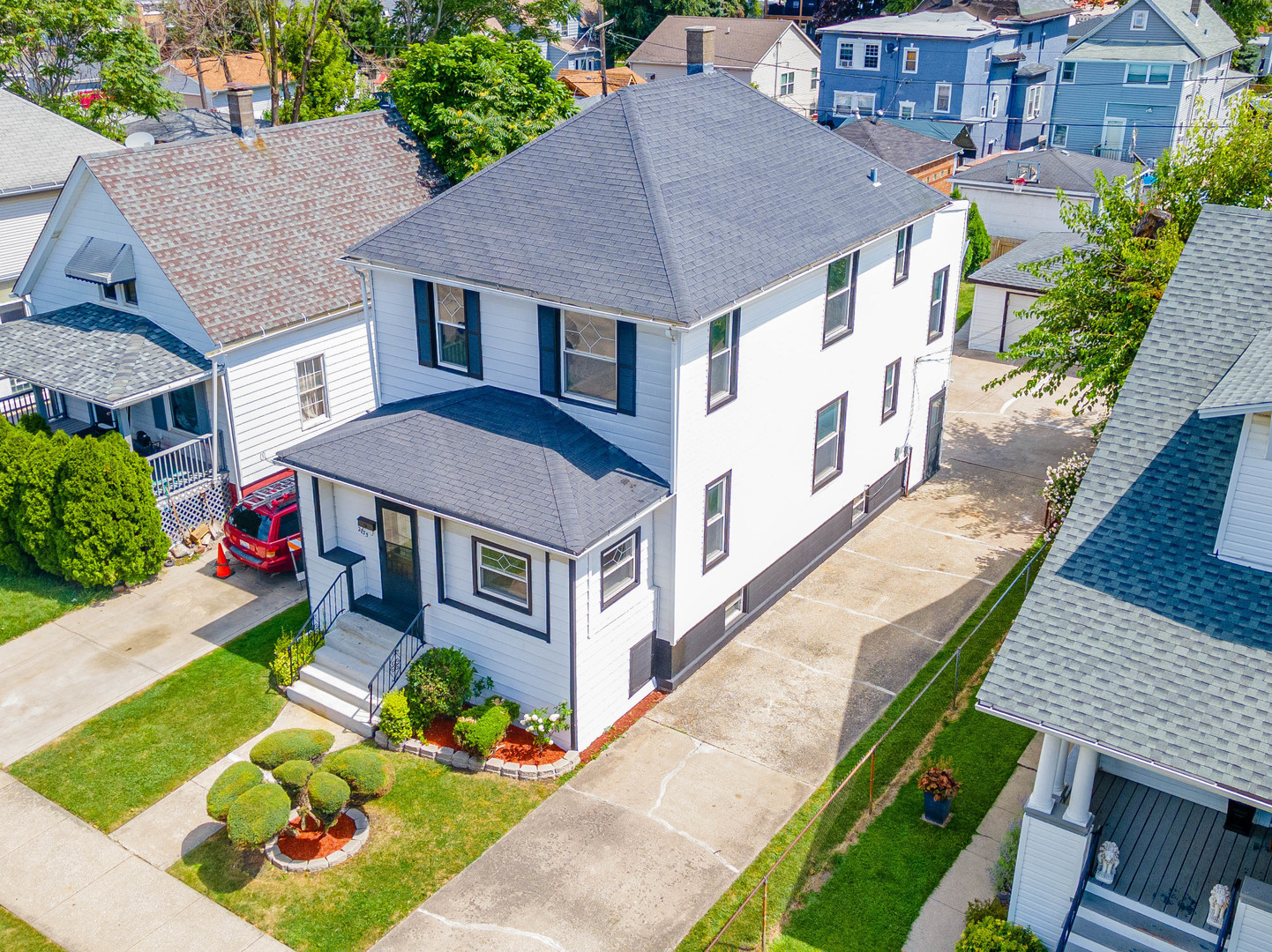 a aerial view of a house with a yard