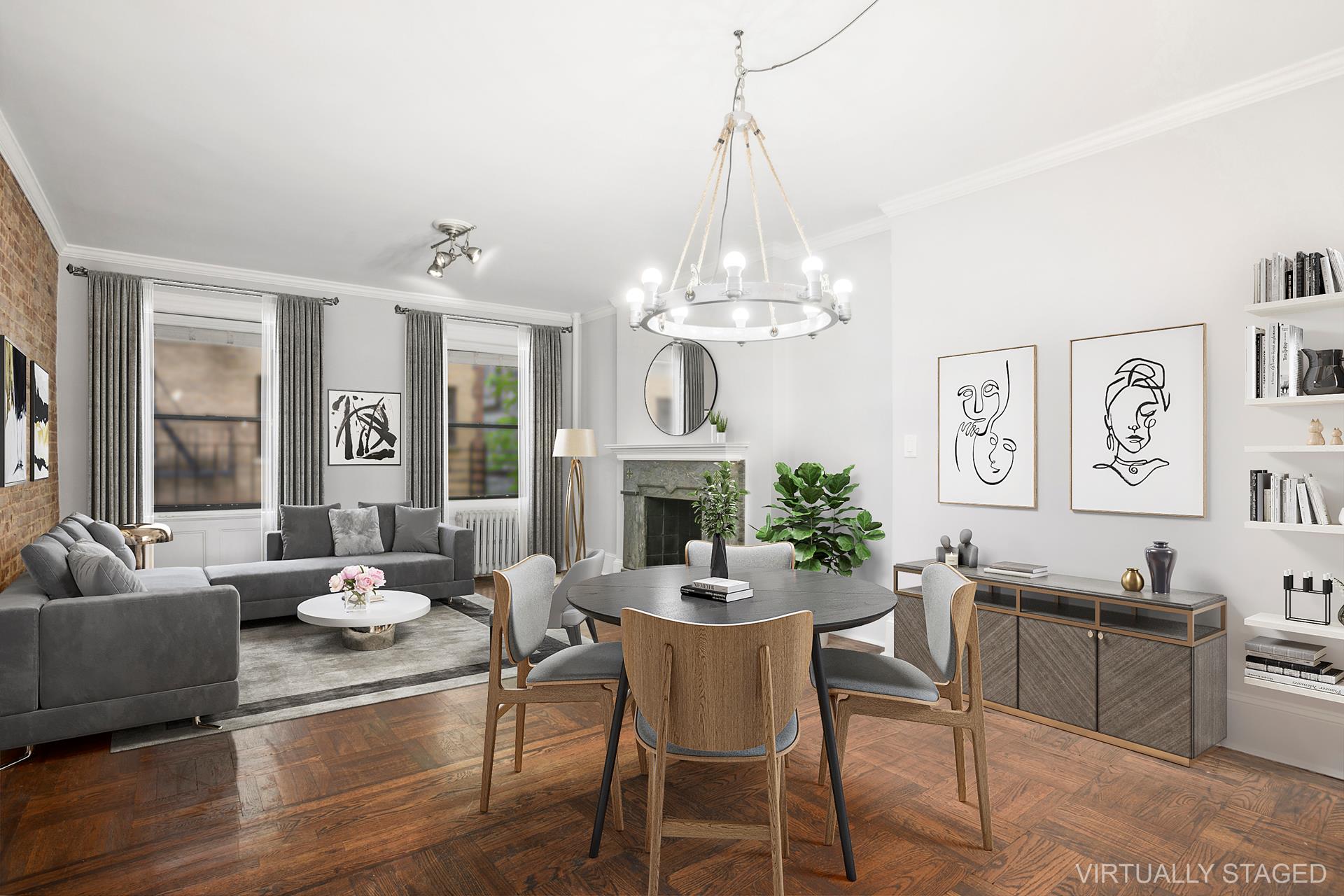 a view of a dining room with furniture a chandelier and wooden floor